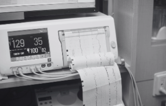 Electronic fetal monitoring machine and tracing in Labor & Delivery